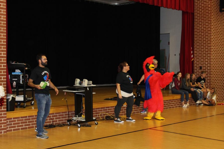 PGA visitor Captain Cardinal comes to meet Pine Grove Elementary School students during their PBIS pep rally.