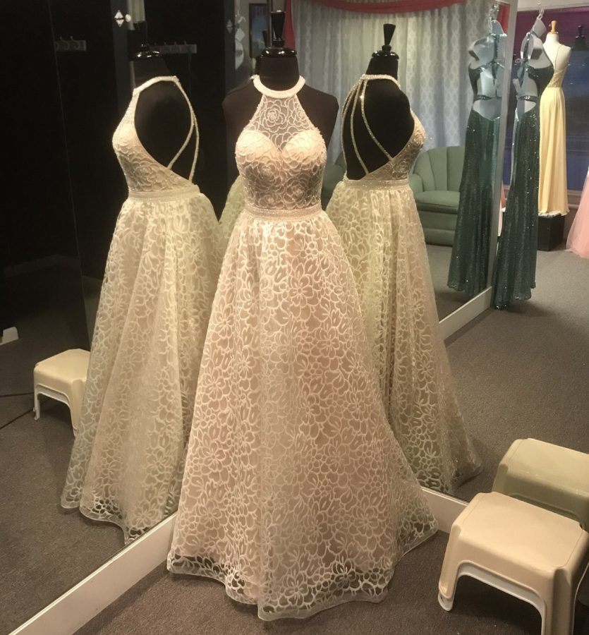 This gorgeous white prom dress on display at Special Moments Bridal Shop.