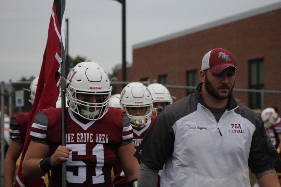 Coach Gaffney leads his varsity football team out to play Tri-Valley for the Gridiron Trophy.