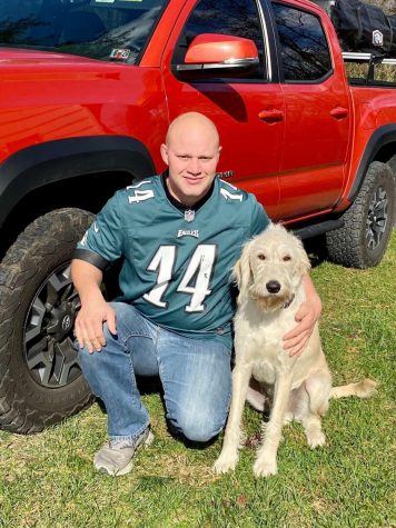 Ted Kemmerling poses with his truck and his dog, Ferris.