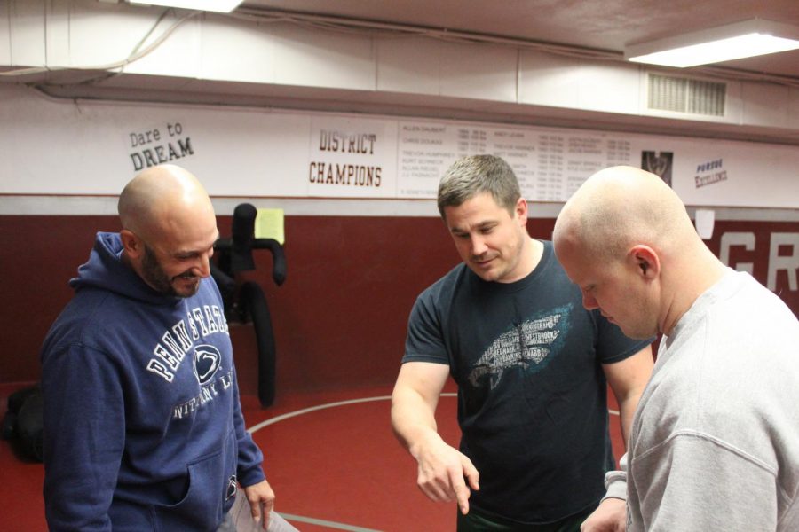 Head Coach Newswanger tells his assistant Coaches Kemmerling and Schneck.