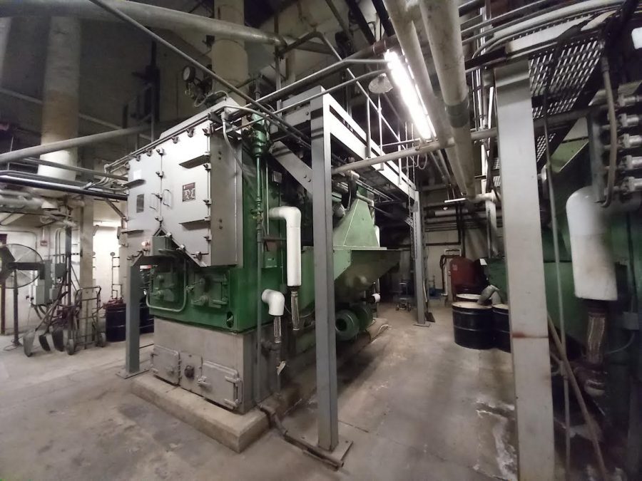 One of the two large boilers in the High School. They work by burning some type of fuel to make heat. Henry Snyder says, Amazingly, they are still coal fed.