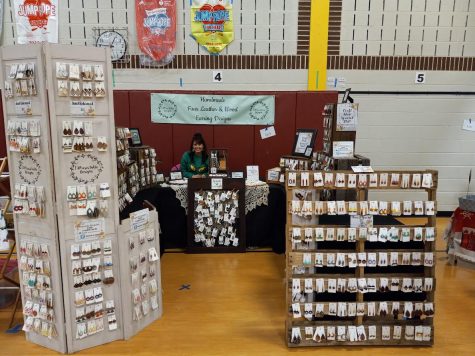 Shandra Allar, at her booth selling leather earrings. Allar is also a Kindergarten teacher in PGA Elementary School. Allar hopes more people support small businesses coming out of the pandemic.