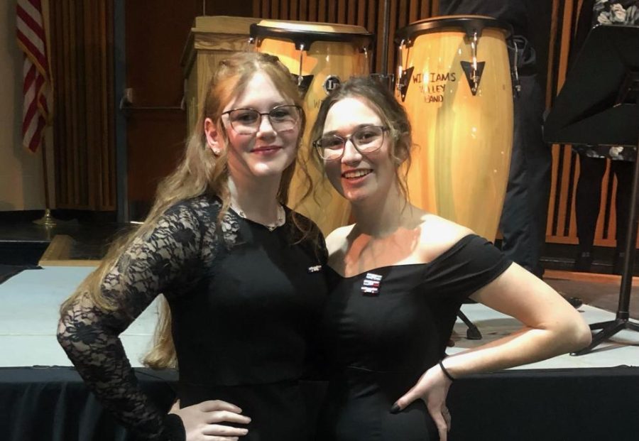 Bailey Drake, sophomore, and Eva Karenda, senior, pose for a picture at the County Chorus performance. “It was a smooth performance. I thought it was really nice being able to sing with people who actually wanted to be there. It made it more professional even when we had our fun,” said Drake.