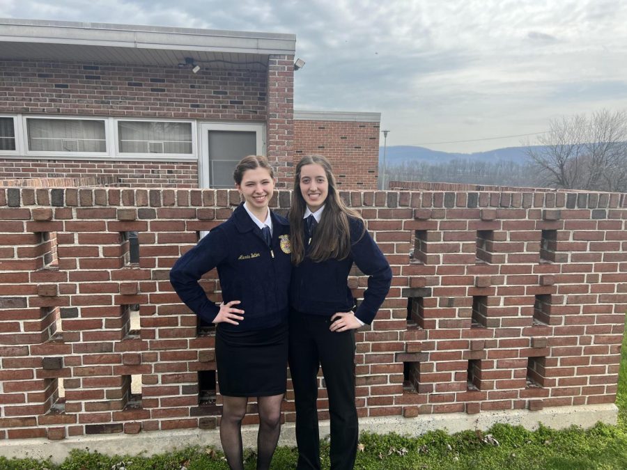 From left to right: Alexis Butler, sophomore, from Pine Grove poses with Regan Kreitzer, junior, from Tulpehocken at the 2022 Regional FFA Public Speaking Competition.
