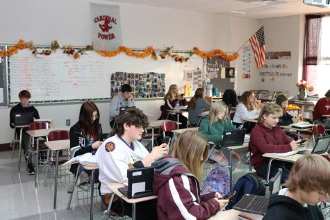 Ninth grade students using technology during an English class.