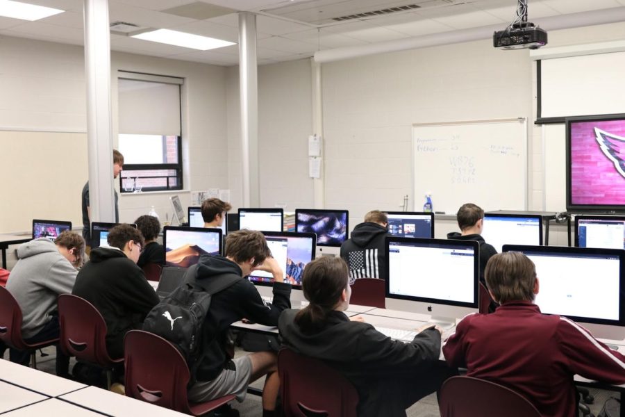 Students doing their assignments on computers, opposed to paper.