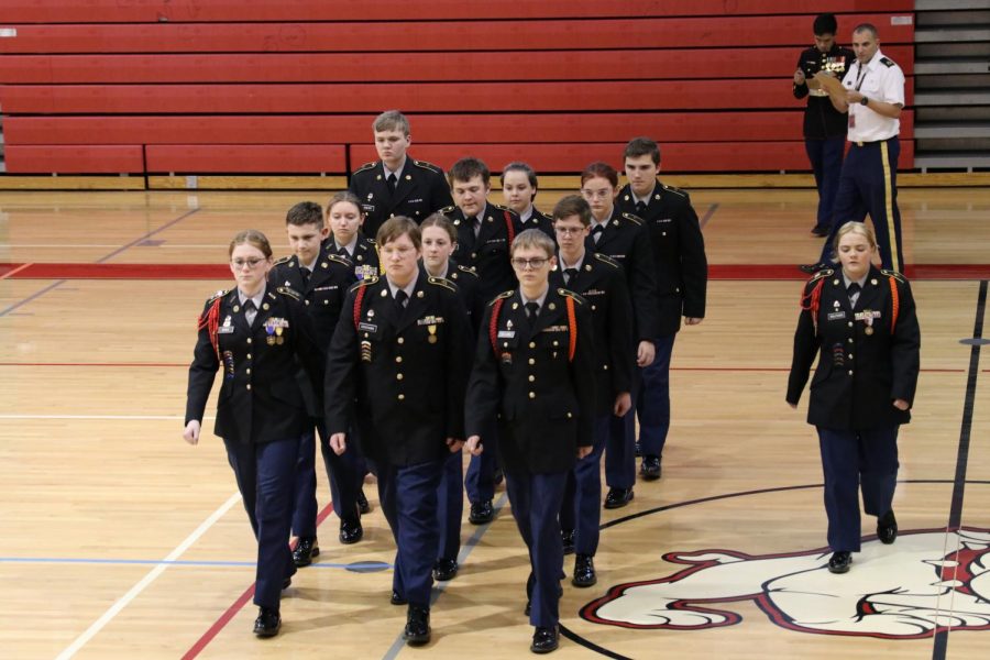 Madyson Wolfgang, junior, marches the Unarmed Drill team through Wilsons gym.