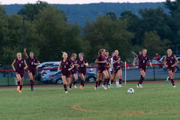 The PGA Girls Soccer Team celebrates after scoring a goal against Williams Valley.