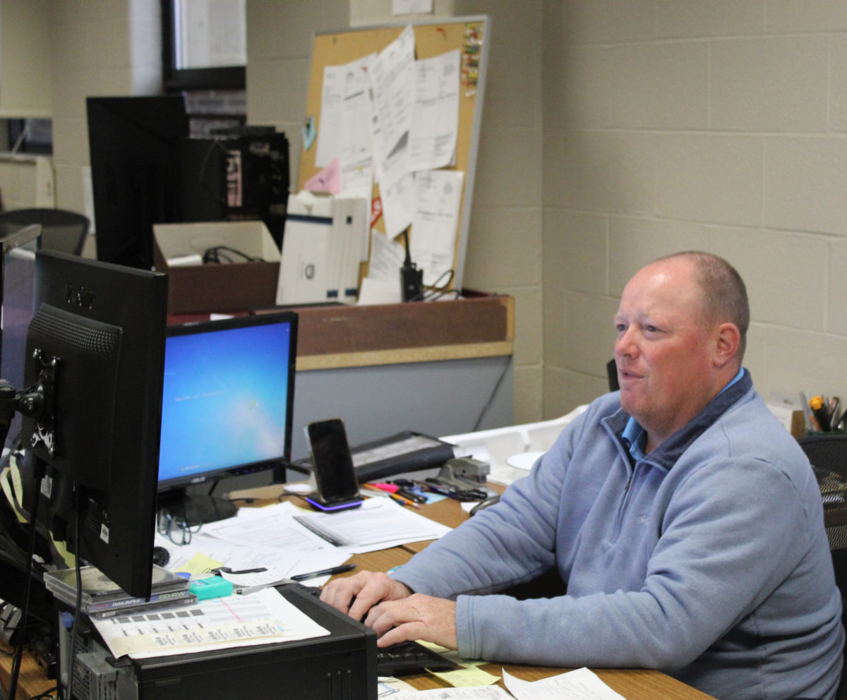 Todd Lengle, Technology Director, working in his office during the school day to continue supporting teachers, students, and administration.