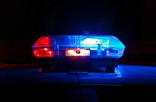 NYPD police lights outside a Brooklyn precinct after an officer's arrest